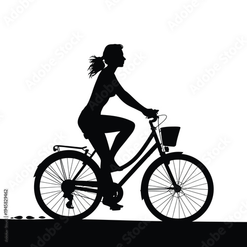 Silhouette of a woman riding a bicycle with a basket