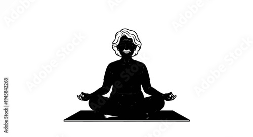 Elderly woman meditates peacefully in a seated yoga pose on a mat