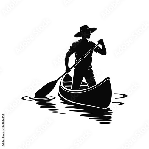 Silhouette of person canoeing in water with paddle