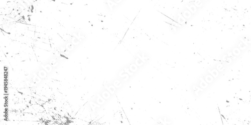 White surface with numerous fine grey scratches and speckles creating a distressed texture background