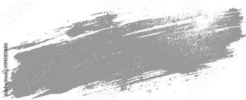 Grey textured brush stroke with rough edges and speckled detail on white background