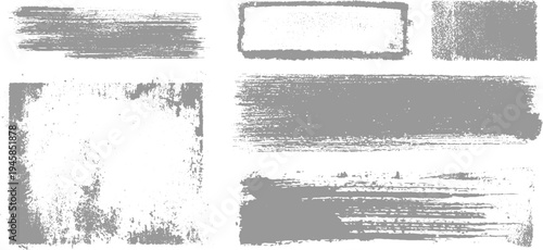 Collection of distressed grey brush stroke textures and grunge frames on white background