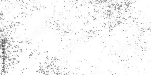 Scattered gray specks and dots on a white background speckle texture