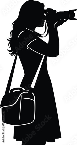 Male photographer silhouette crouching with camera and flash taking photo of young female model standing in studio isolated on white.