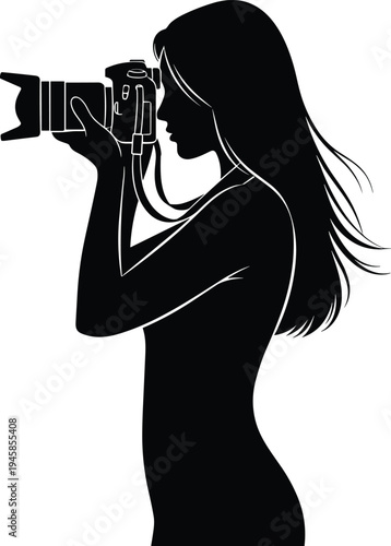 Male photographer silhouette crouching with camera and flash taking photo of young female model standing in studio isolated on white.