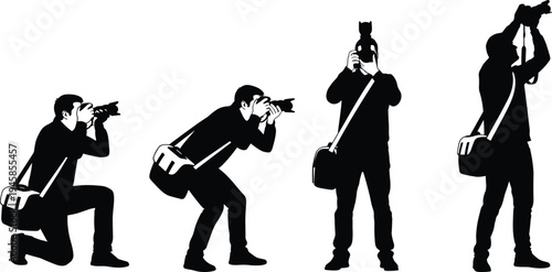 Male photographer silhouette crouching with camera and flash taking photo of young female model standing in studio isolated on white.