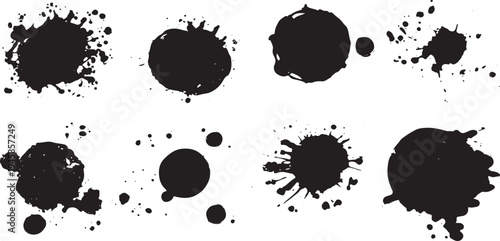 Black ink splatters and drips on white background ink drops
