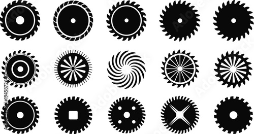 Collection of black and white circular saw blades with various tooth patterns and industrial