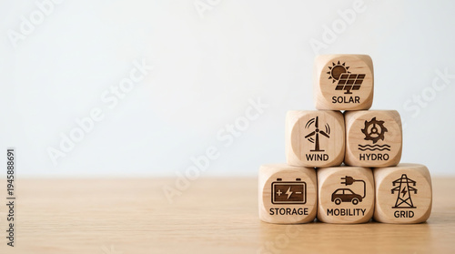 Wallpaper Mural Renewable energy concept with wooden blocks showing solar, wind, hydro, storage, mobility, and grid icons stacked on wooden surface, symbolizing sustainable power solutions Torontodigital.ca