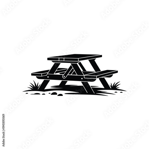 A simple black and white illustration of a picnic table outdoors