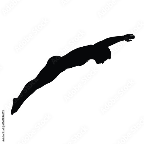 Silhouette of a swimmer in mid air executing a diving motion