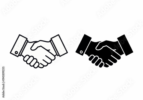 Two hands shake in a business agreement indoors in office