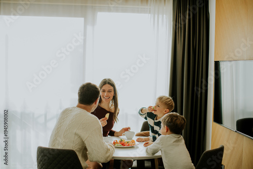 Family shares a meal togeth...