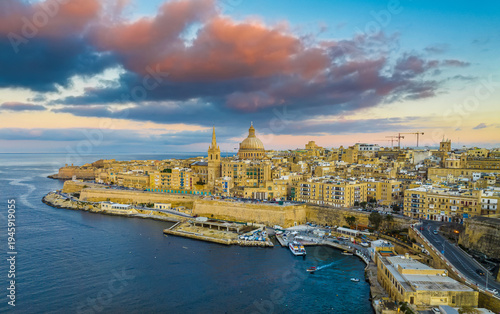 Drone sunset view of Valletta city - capital of Malta. Sunset, church. Mediterranean sea