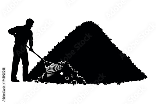 Man raking leaves into a large pile
