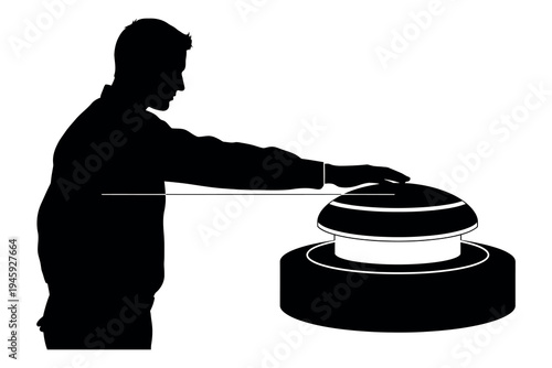 Silhouette of a man placing a lid on a large industrial or commercial food warming dish