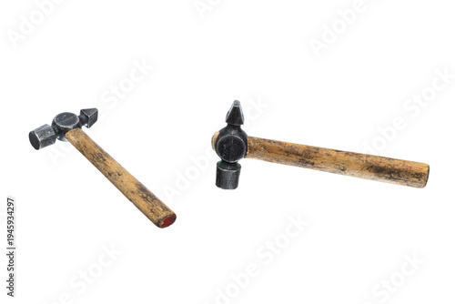 Two small metal hammers with wooden handles isolated on white background. Hand tools for repair, workshop and craft use.