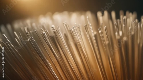 Extreme close up slow motion of brush bristles moving gently with soft lighting creating abstract texture and depth
