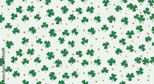 A festive St. Patrick's Day background pattern featuring numerous green shamrocks and small golden dots.