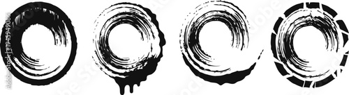 Set of four black circular brush stroke ink rings grunge artistic round frames isolated on white background