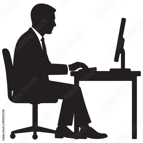 Silhouette of a businessman typing on a computer at a desk, focused on work.