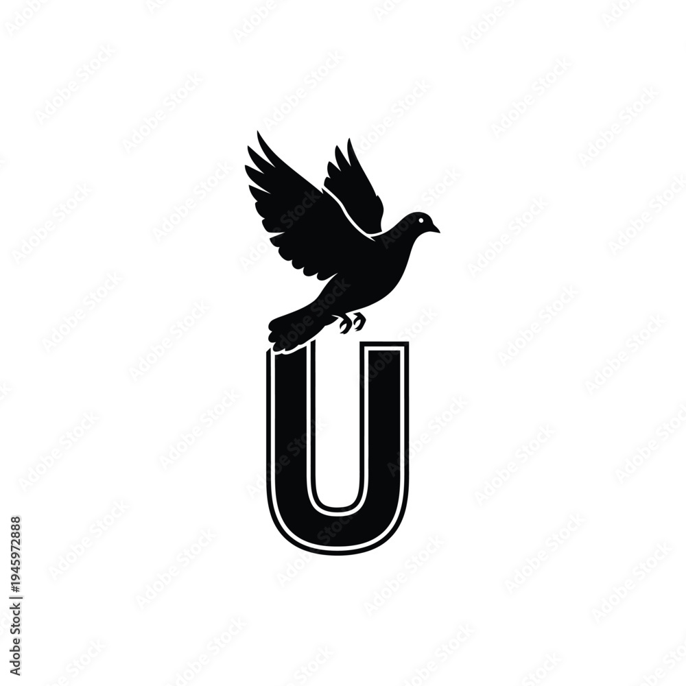 Fototapeta premium Black bird perched on bold letter u flying