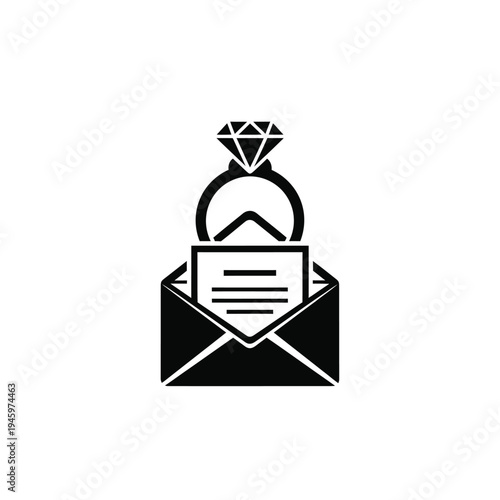 Black and white of engagement ring inside open envelope