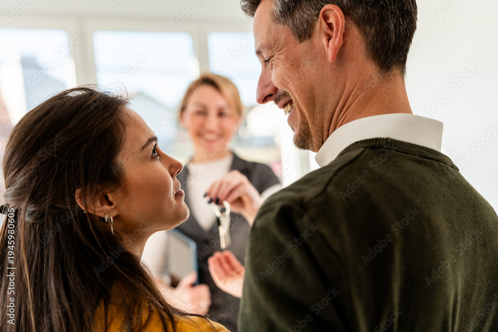 Naklejka premium Couple Taking Keys Of Their New Home