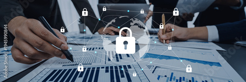 Foto Hands engage in financial analysis while a digital lock symbol emphasizes data security in an interconnected world, highlighting the importance of protection