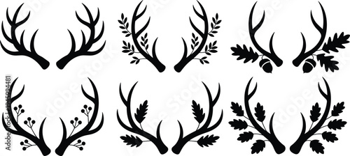 Silhouettes of decorative deer antlers with leaves, acorns, berries, foliage, vector illustration for wildlife, nature, rustic design, art, emblem