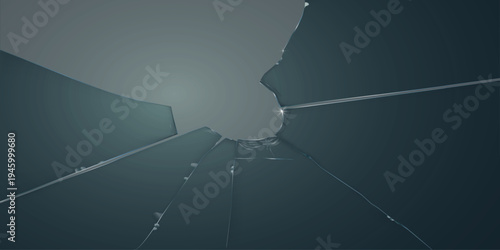 Broken dark glass window shards with cracks showing on dark background.