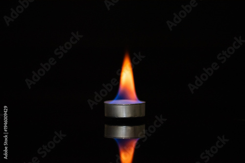 Calcium Flame Test – Colorful Chemical Reaction on Black Background