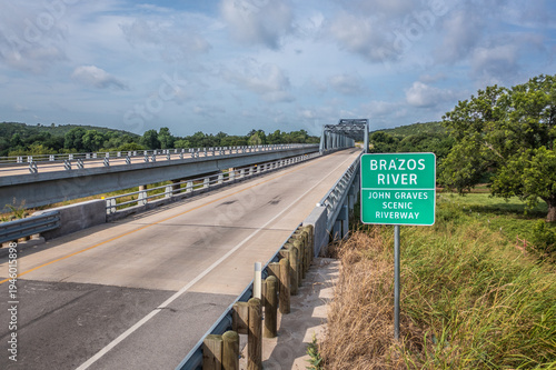 Quadro em tela Brazos River Sign Near Empty Bridge With Road Over River in Mineral Wells, Texas