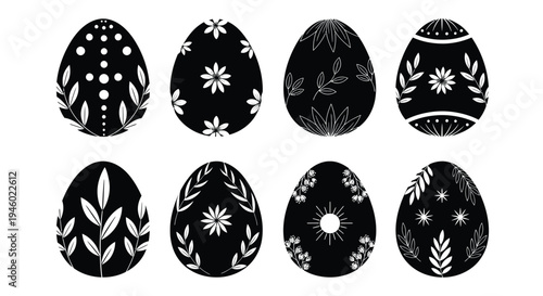 Eight decorated black and white Easter eggs displayed.