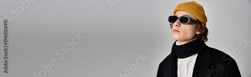 Quadro su tela Stylish handsome man in trendy winter outfit showcasing contemporary fashion for