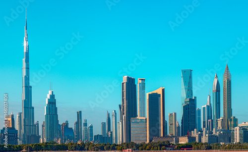 Panoramic skyline of Dubai with modern skyscrapers and futuristic architecture at sunset. Iconic cityscape of the largest city in the United Arab Emirates, famous for luxury tourism, business district