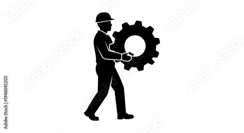 Man holding large gear wheel.