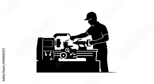 Man working on metal lathe machine.