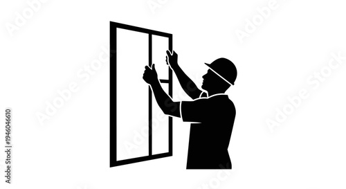 Man installing a window frame.