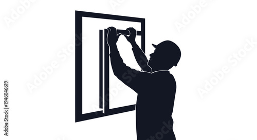 Man installing a window frame.