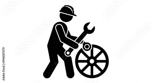 Mechanic repairing a wheel with wrench.