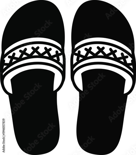 Pair of simple black and white flip flops with decorative patterned straps for summer beach wear