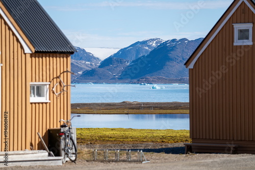 Fényképezés Bicycle parked beside a building at the research station at Ny Alesund, Svalbard