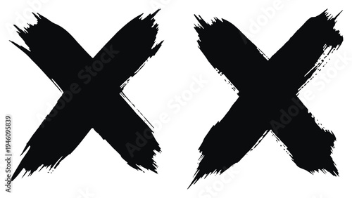Two black brush stroke x marks on white background