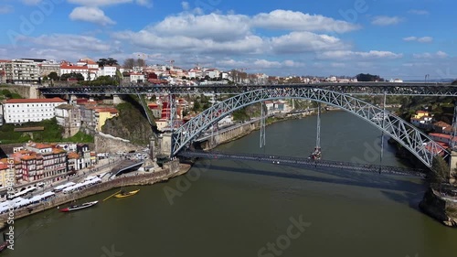 Porto, Portugal. Aerial view of bridge Ponte Luís I and famous historical district Ribeira. 4K video.
