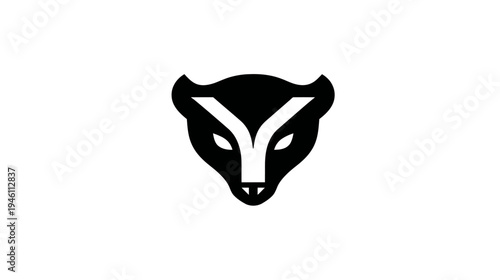 Minimalist black and white stylized animal head icon. Abstract modern geometric design of a fox or badger face graphic.
