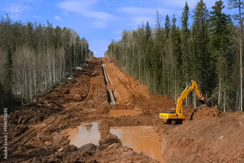 Schilderij op canvas Pipelayer laying pipeline in trench, construction gas pipeline among forest