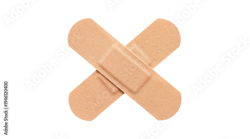 Bild auf Leinwand Two crossed adhesive bandages, skin-colored fabric texture, medical first aid su
