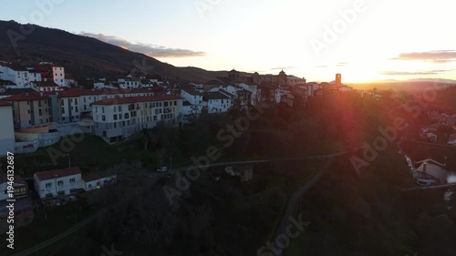 Aerial images of Bejar in the province of Salamanca with the Sierra Nevada mountains in the background during sunset, 4k 30fps 1 inch sensor DJI, drone image