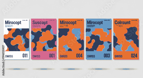 Colorful abstract book covers with orange blue and pink hues on a light gray background